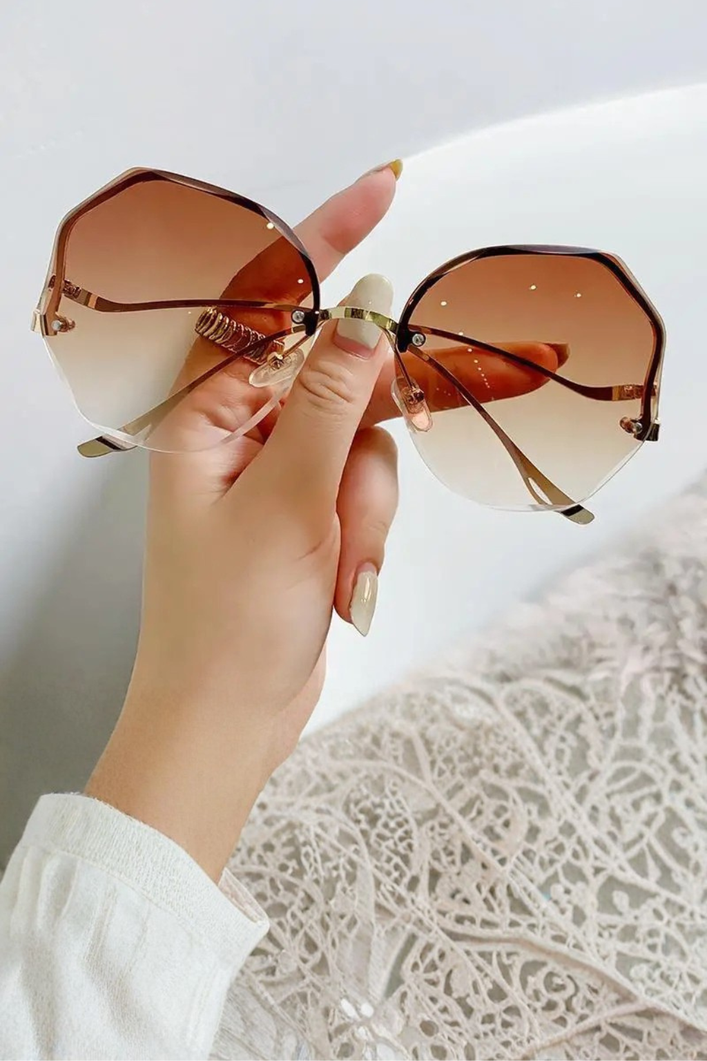 Large oversized rimless sunglasses with progressive tinted lenses