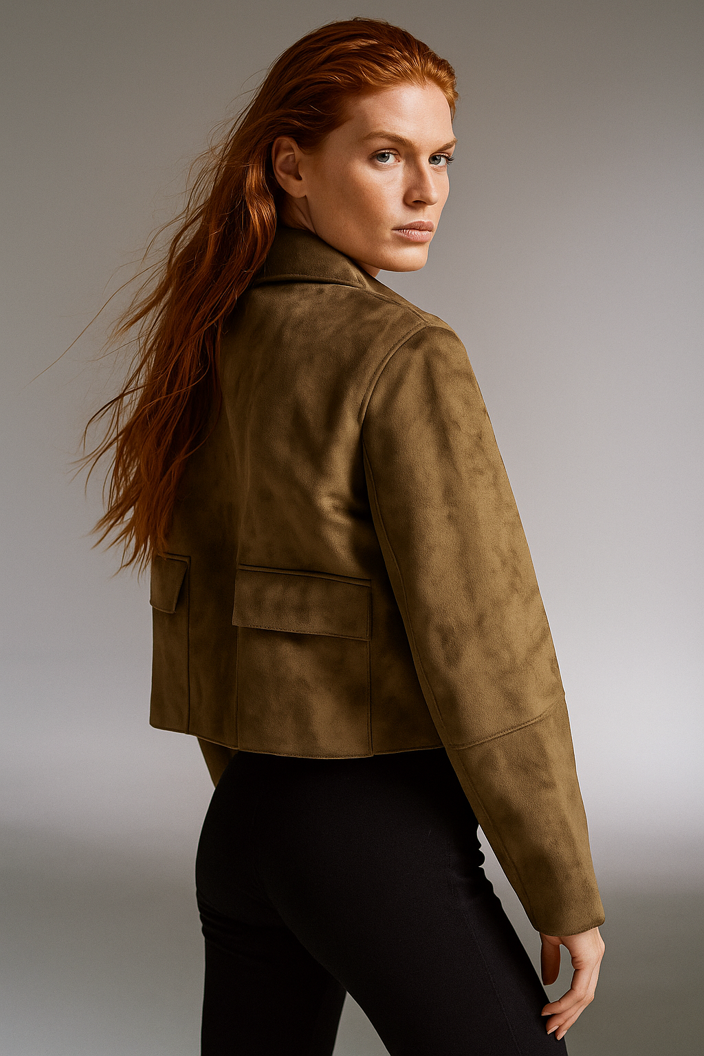 Women's cropped jacket with lapels, single button closure, and chest pockets