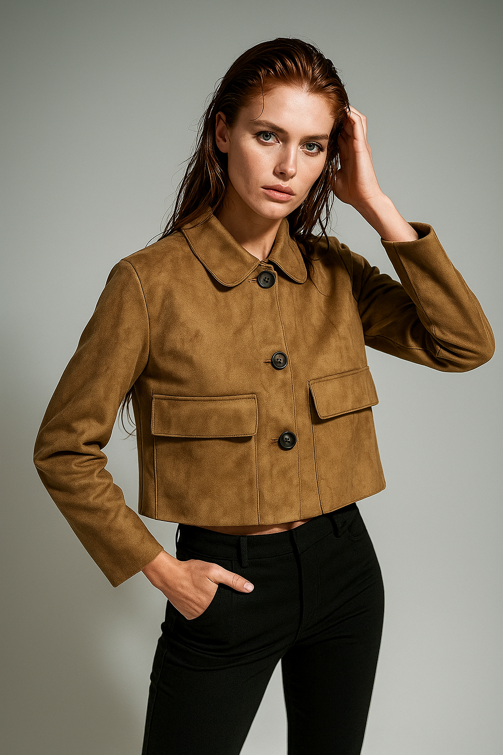 Women's cropped jacket with lapels, single button closure, and chest pockets